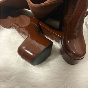 Sophisticated Brown Heeled Boots with Glossy Finish